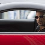 Will Smith in a red car