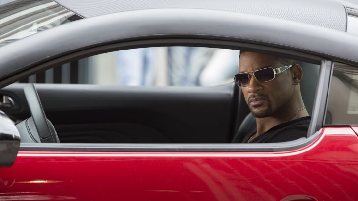 Will Smith in a red car